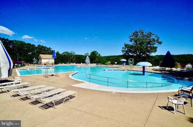 pool with a patio area