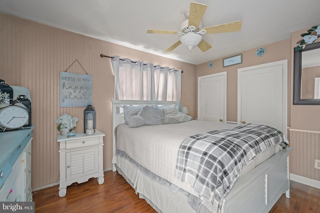 bedroom with a ceiling fan and wood finished floors