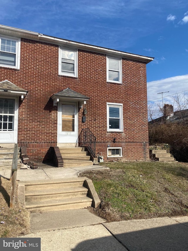 view of front of home with brick siding and entry steps