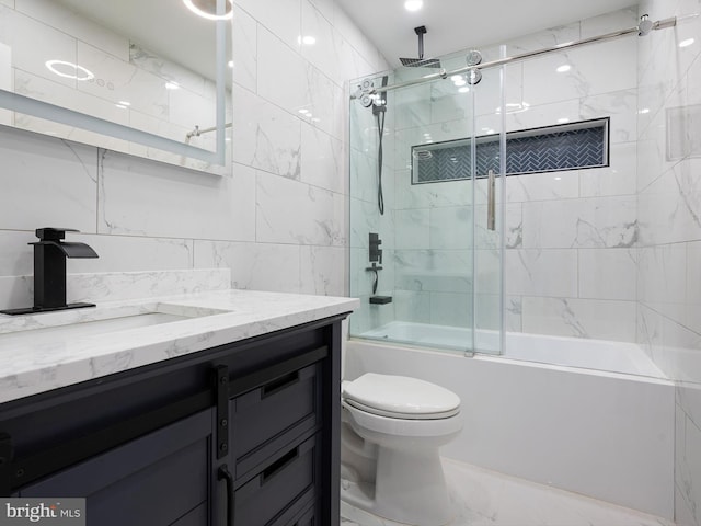 full bathroom featuring vanity, toilet, marble finish floor, and a combined bath / shower with rainfall shower