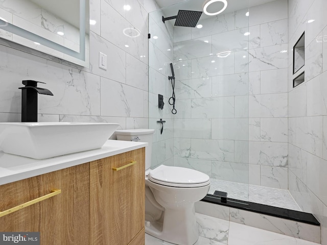 full bathroom featuring vanity, walk in shower, tile walls, toilet, and marble finish floor