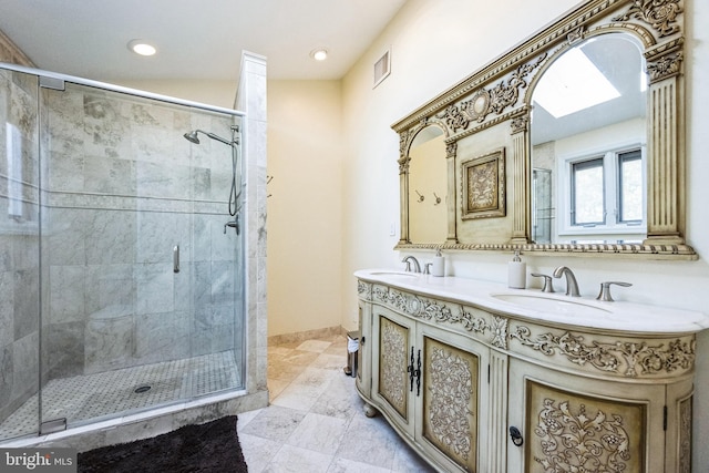 full bathroom with a shower stall, double vanity, visible vents, and a sink