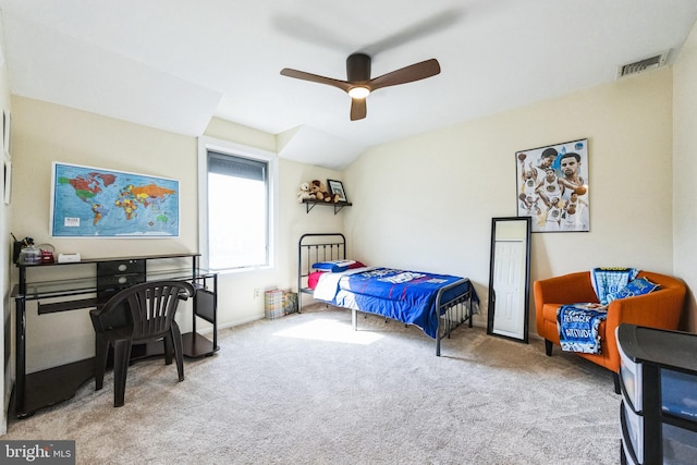 carpeted bedroom with visible vents, lofted ceiling, and ceiling fan