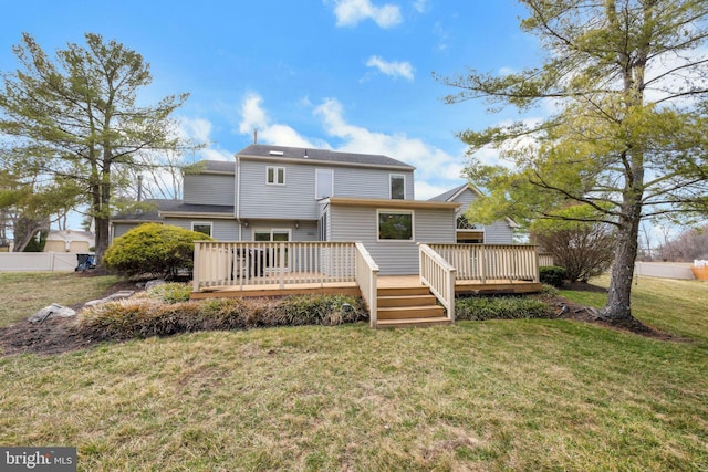 back of property featuring a yard and a deck