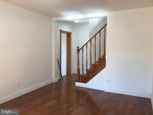 stairs with baseboards and wood finished floors