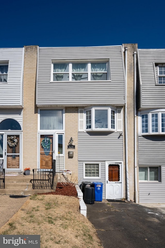 multi unit property featuring brick siding