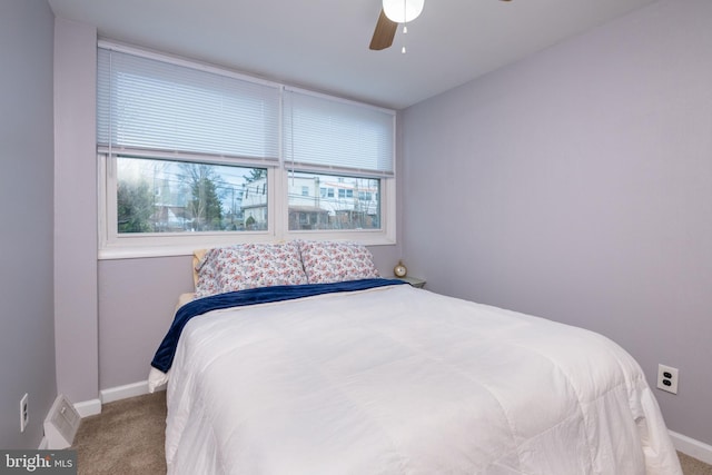 bedroom featuring carpet flooring, a ceiling fan, and baseboards