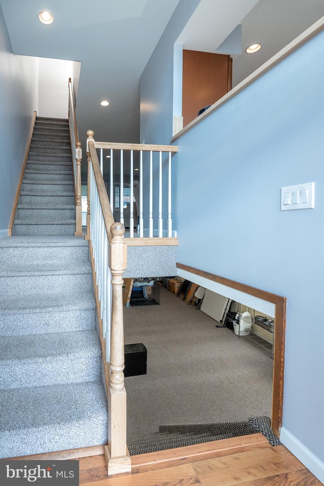 stairs featuring recessed lighting and baseboards