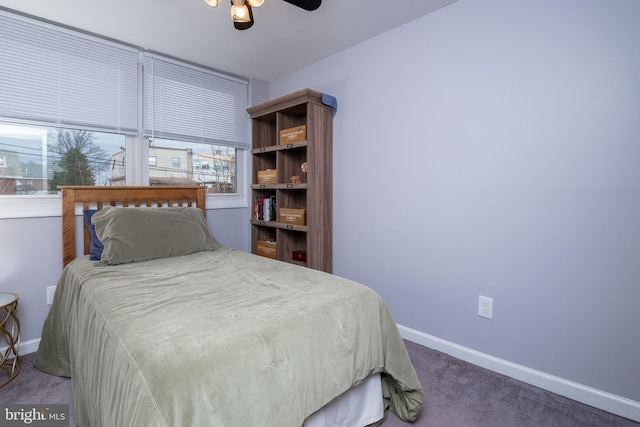 bedroom featuring carpet flooring, a ceiling fan, and baseboards