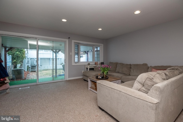 living area with recessed lighting, baseboards, and carpet flooring