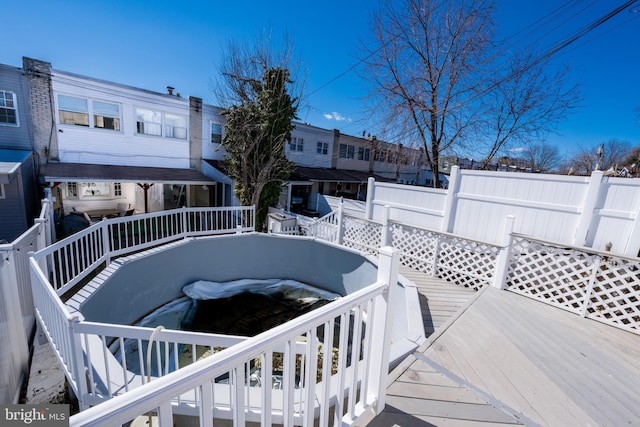 exterior space with a deck and fence