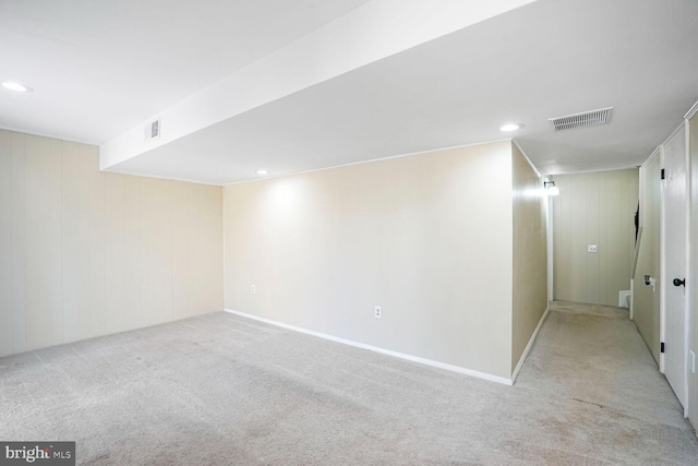 finished below grade area featuring recessed lighting, visible vents, and carpet flooring