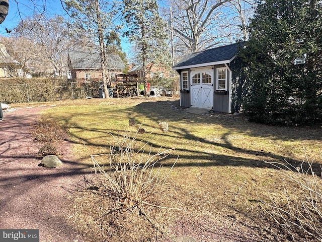 view of yard with an outbuilding and a shed