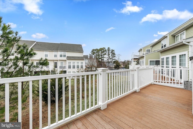 wooden terrace with a residential view