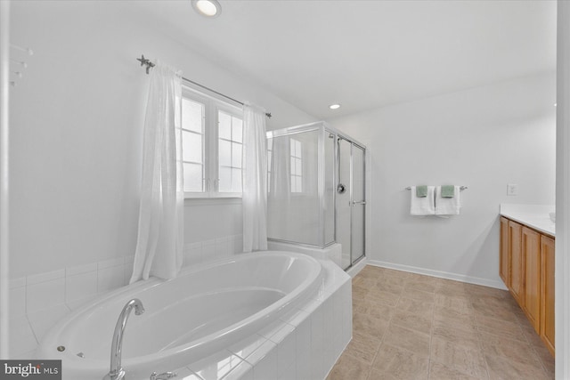 full bathroom featuring a shower stall, baseboards, a garden tub, recessed lighting, and vanity