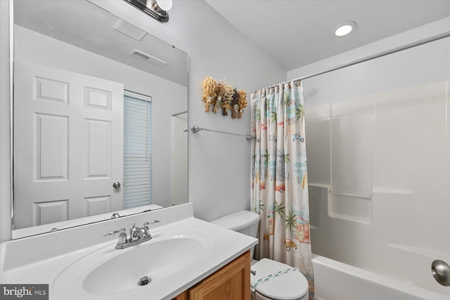 full bath with visible vents, toilet, vanity, and shower / tub combo with curtain