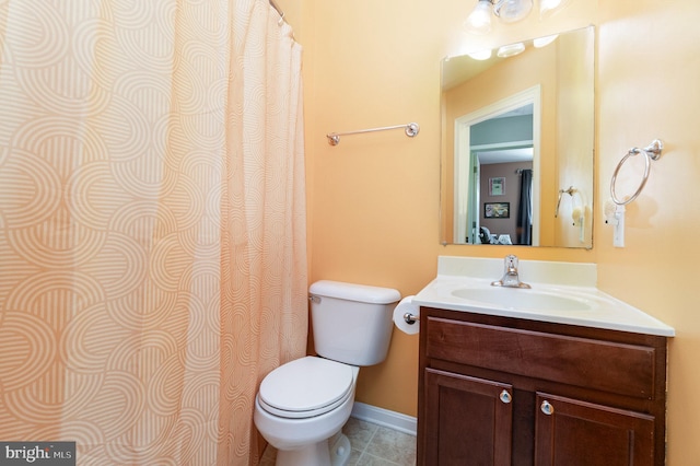 full bath featuring vanity, tile patterned floors, toilet, and baseboards