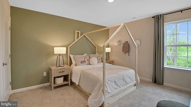 bedroom with carpet flooring, visible vents, and baseboards