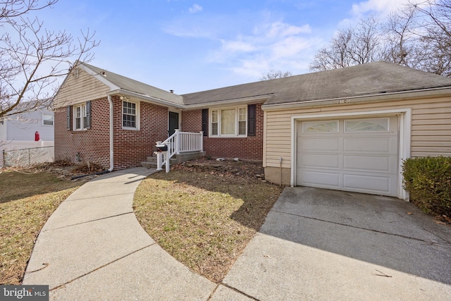 ranch-style house with brick siding, concrete driveway, a garage, and fence