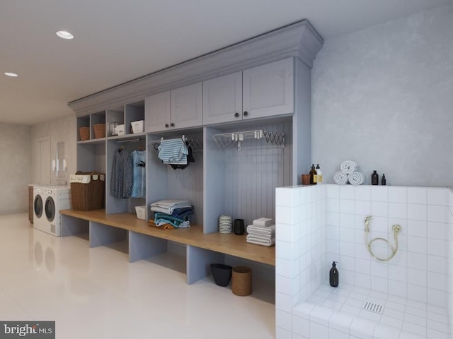 mudroom featuring recessed lighting and separate washer and dryer