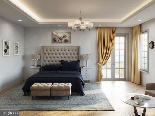 bedroom featuring a raised ceiling, a notable chandelier, and baseboards