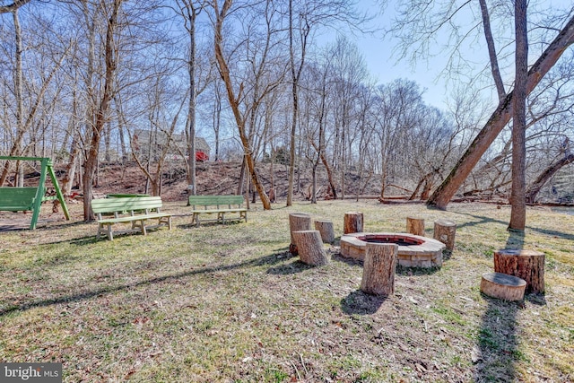 view of yard with a fire pit