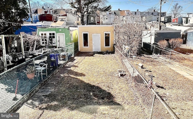 exterior space with a residential view, stucco siding, and fence