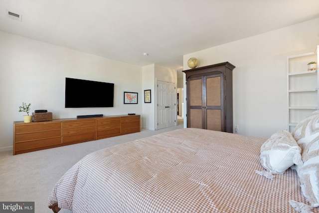 bedroom featuring visible vents and carpet