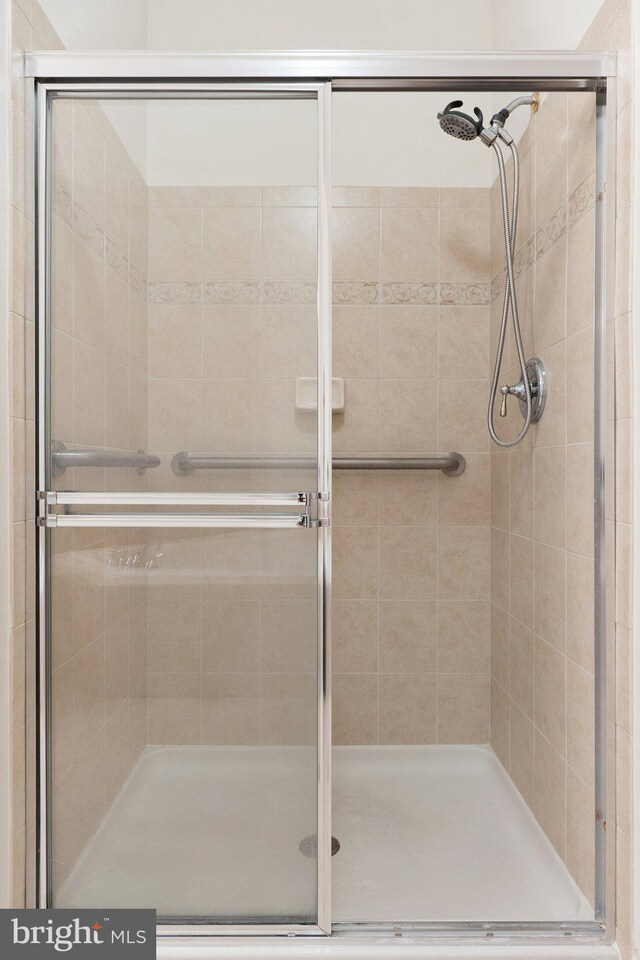 bathroom with a shower stall