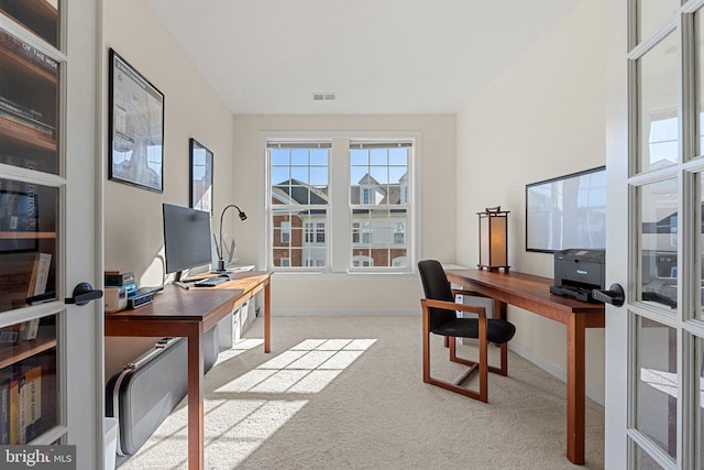 office featuring visible vents, baseboards, and carpet