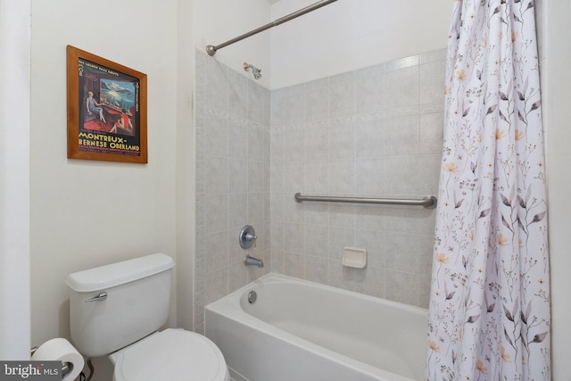 bathroom with toilet and shower / bath combo