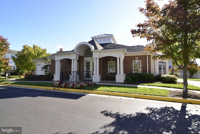 view of front of home with brick siding