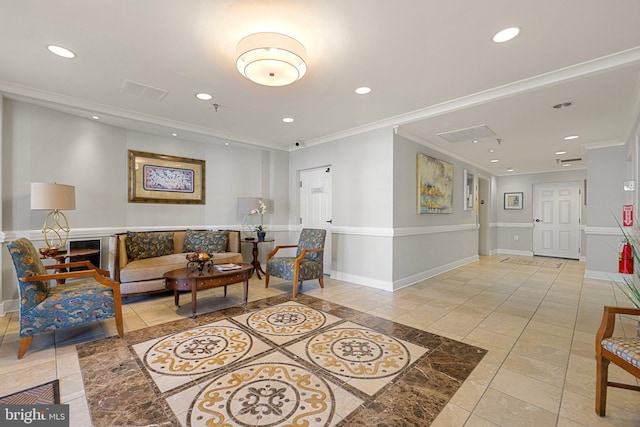 living room featuring recessed lighting, baseboards, and ornamental molding