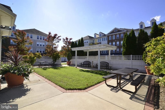 exterior space featuring fence, a yard, a patio area, and a pergola