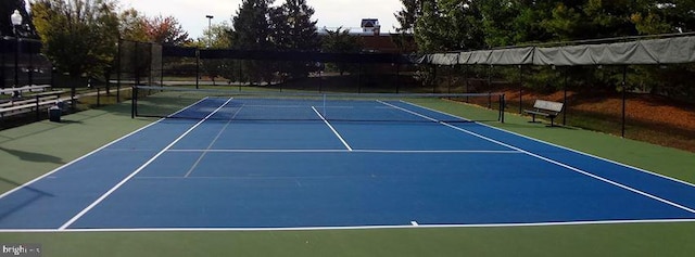 view of sport court with fence