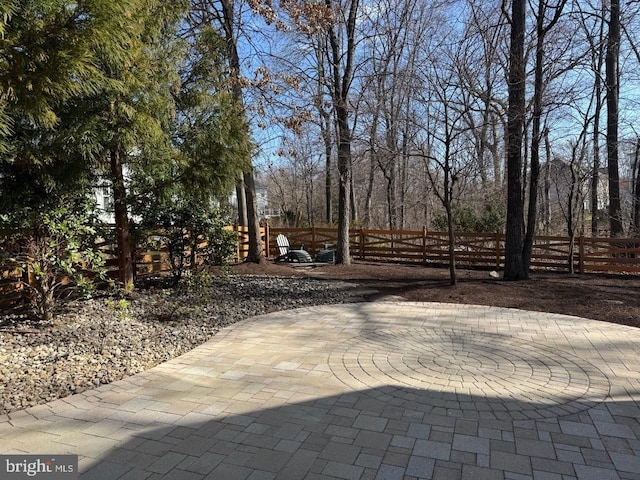 view of patio featuring fence