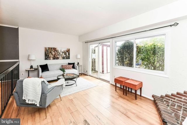 living room featuring baseboards and light wood finished floors