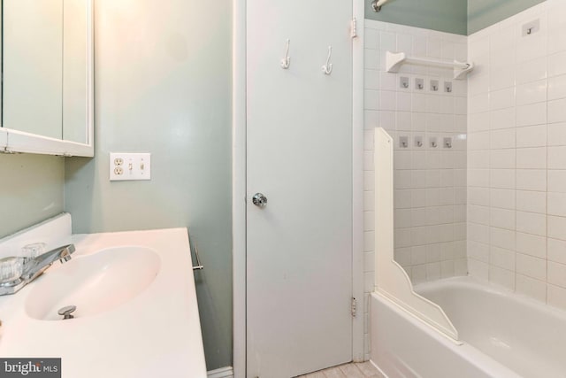 bathroom featuring vanity and bathing tub / shower combination