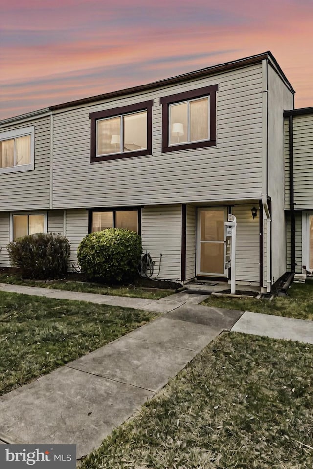 view of property with a front yard