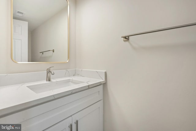 bathroom featuring vanity and visible vents