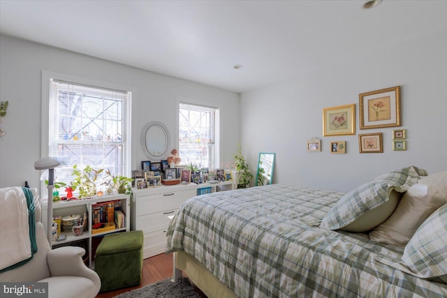 bedroom with wood finished floors