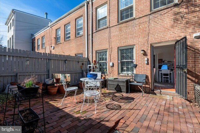 view of patio featuring fence