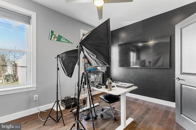 office space featuring a ceiling fan, wood finished floors, and baseboards