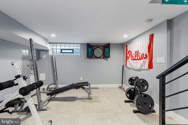 exercise area featuring recessed lighting and baseboards