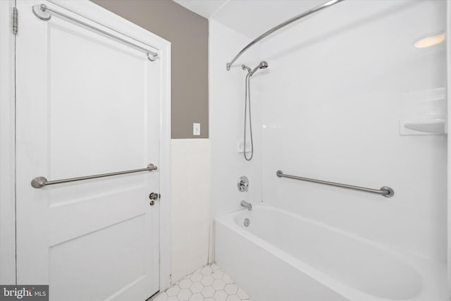 bathroom featuring tile patterned floors and shower / tub combination