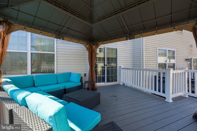 deck featuring a gazebo and outdoor lounge area