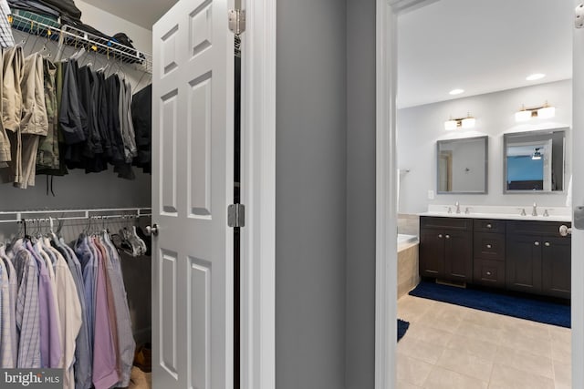 528 Shaw St, Mechanicsburg, PA 17050 - bathroom with double vanity, tile patterned flooring, a bathtub, recessed lighting, and a walk in closet