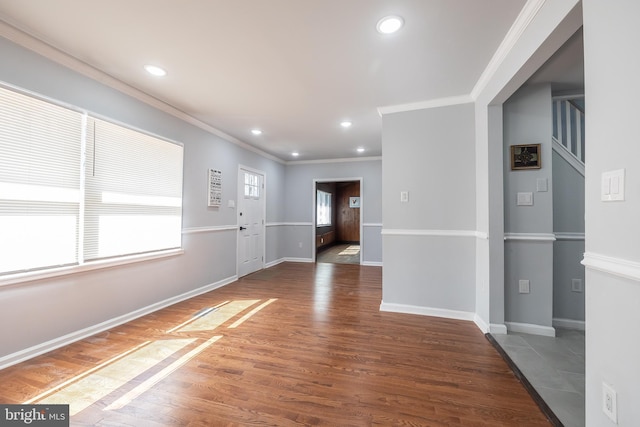 foyer featuring crown molding, recessed lighting, and wood finished floors