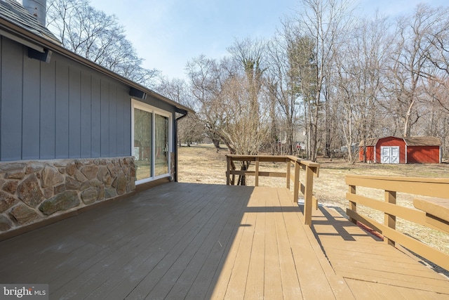 deck featuring an outbuilding and a shed