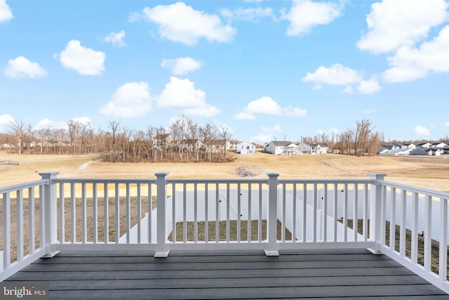 wooden deck featuring a residential view